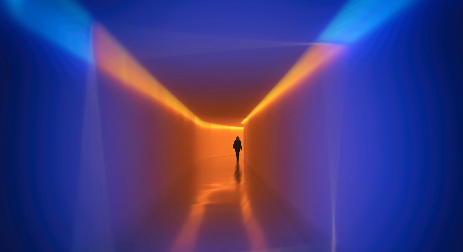 blue and orange back person walking