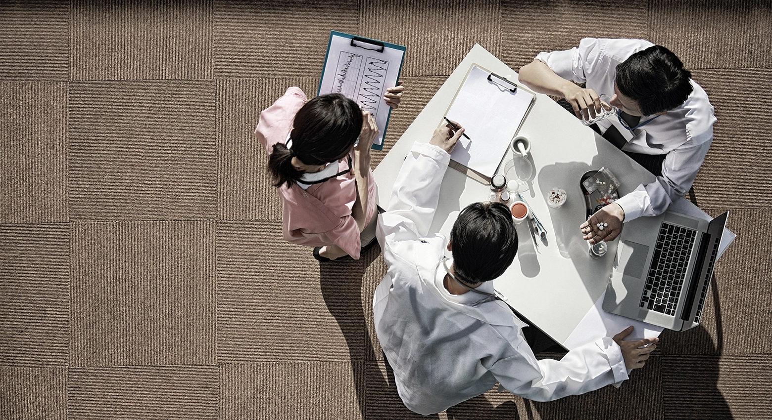 doctors talking about medicine and looking at data