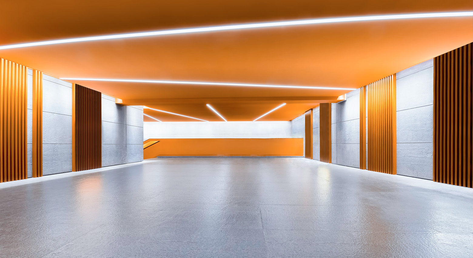 Orange and gray hallway with lights 