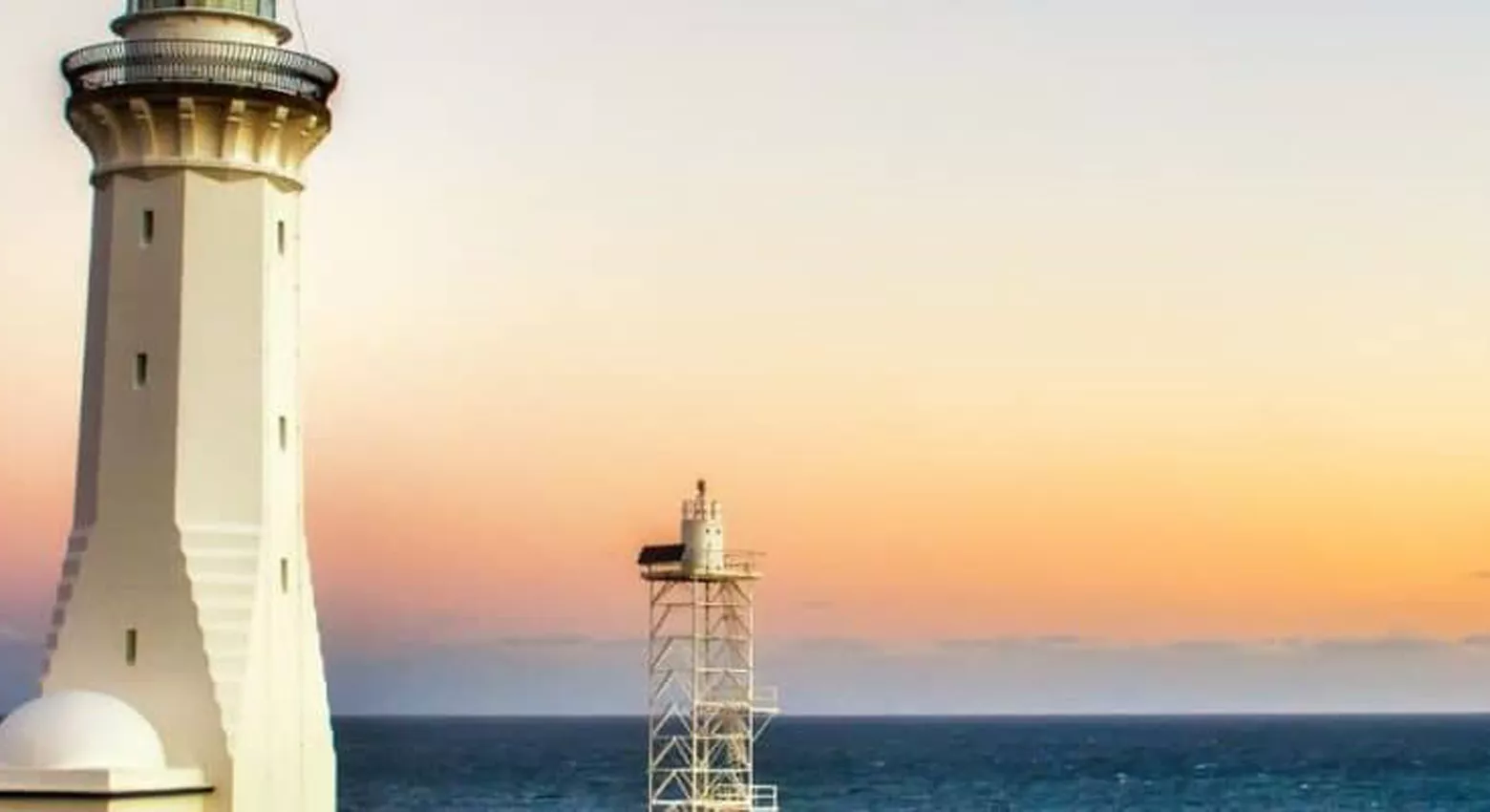 Lighthouse in front of the ocean