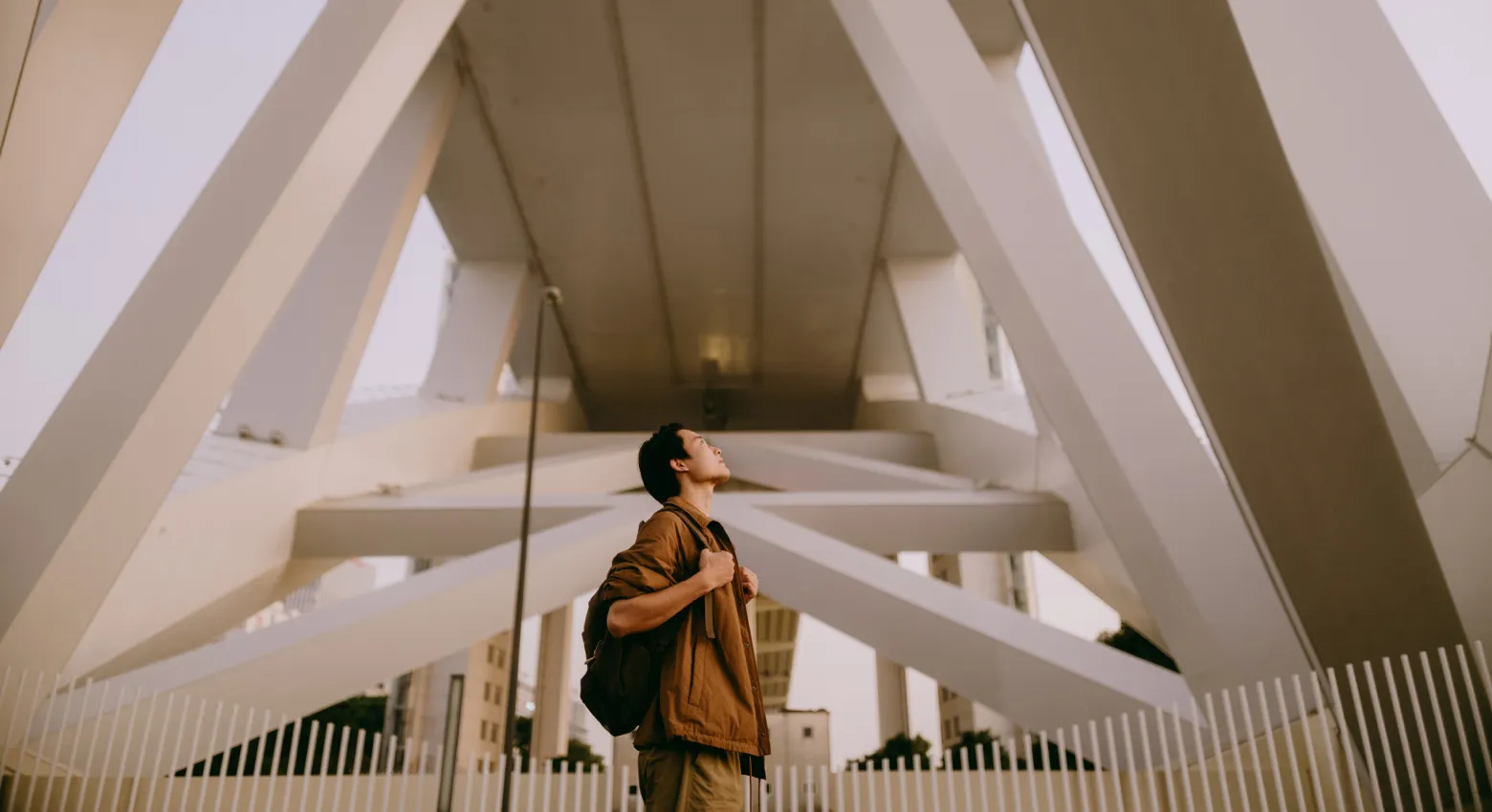 man looking at modern architecture