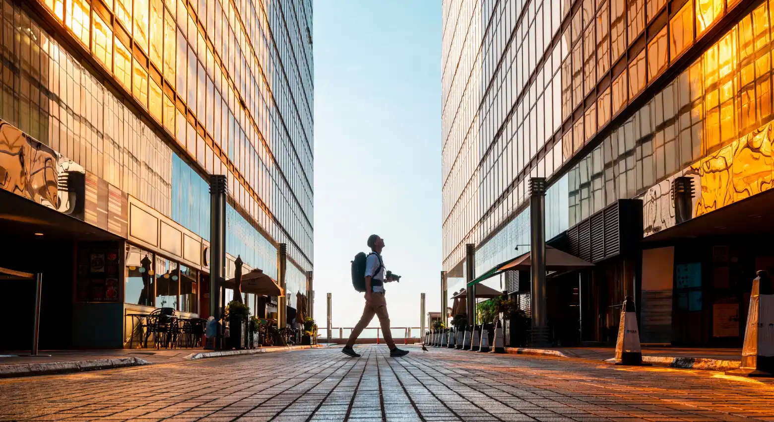Man walking by modern architecture 
