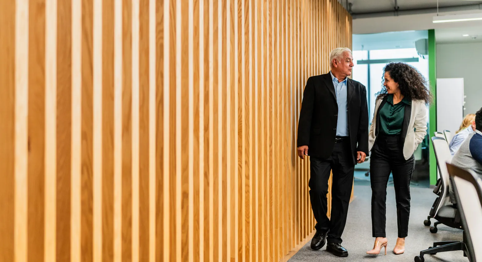 man and woman in office talking