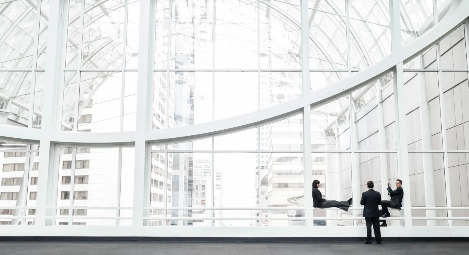 People walking by modern architecture 