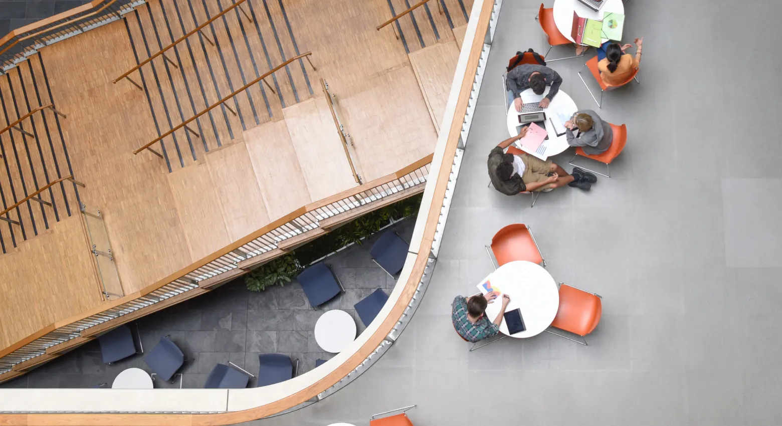 students working on modern college interior 