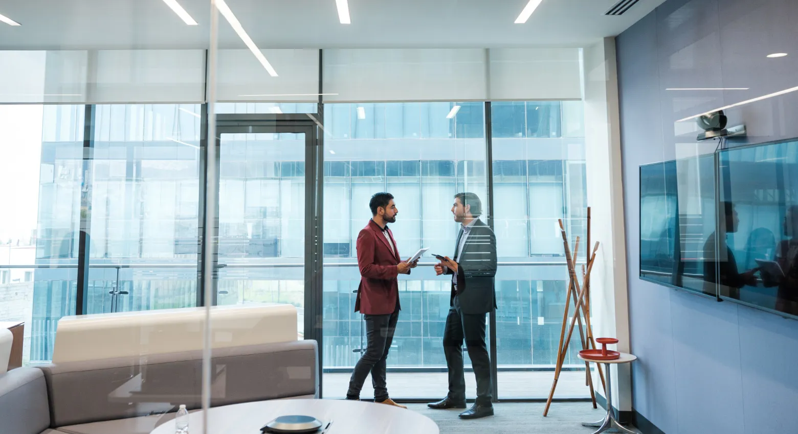 two men talking in office