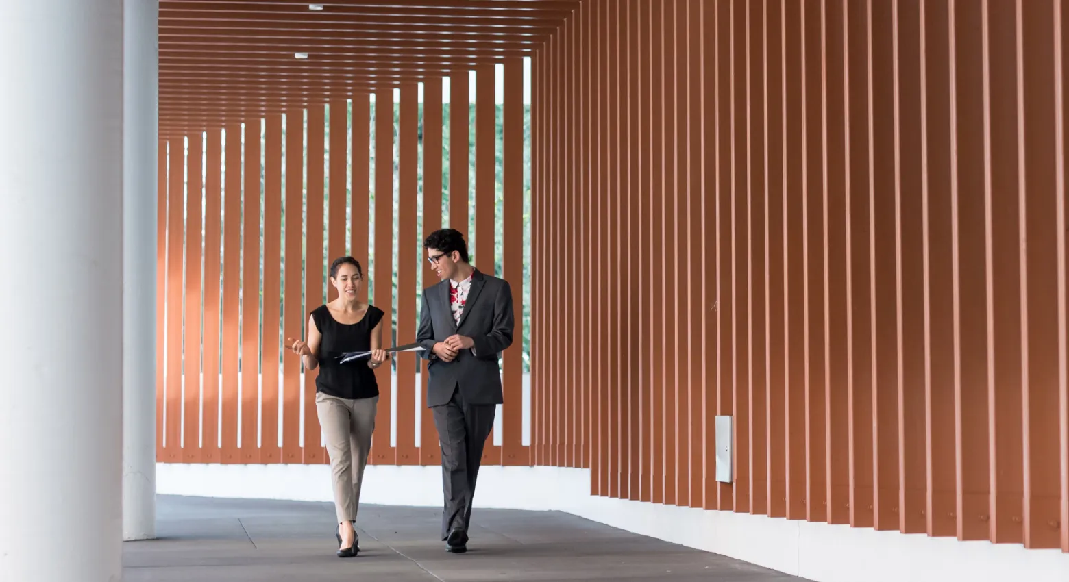 woman men walking modern architecture