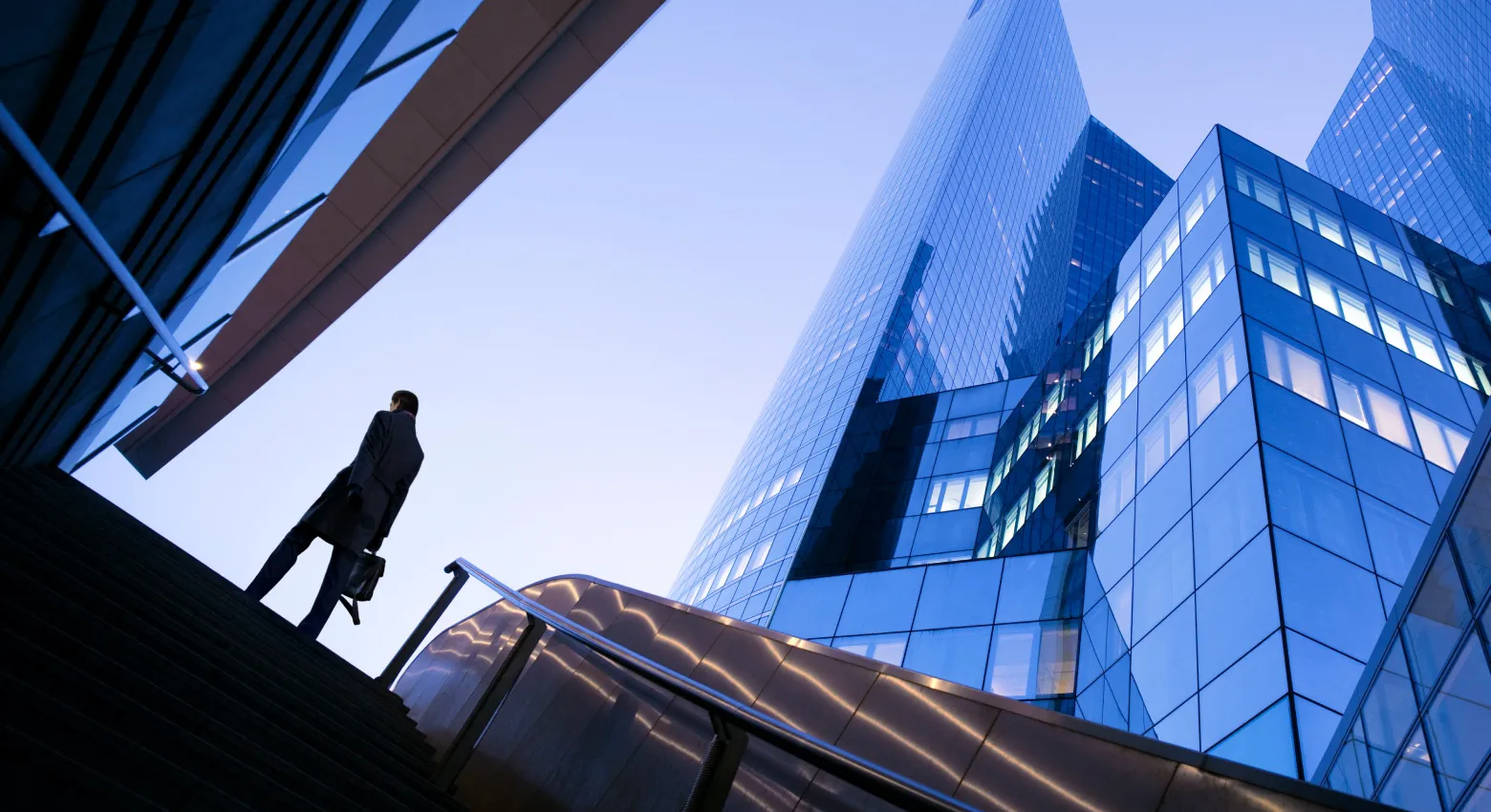 Person walking around modern architecture 
