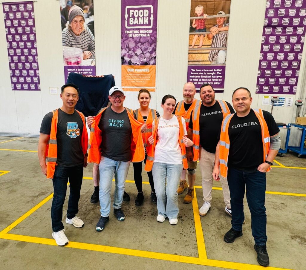 Volunteers posing with orange vests 