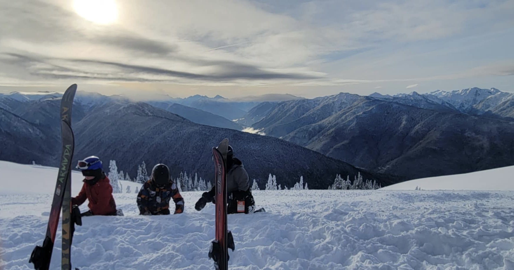 people skiing at sunset