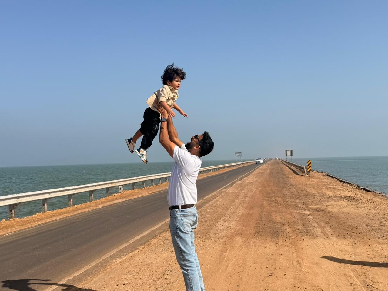 dad picking up his son