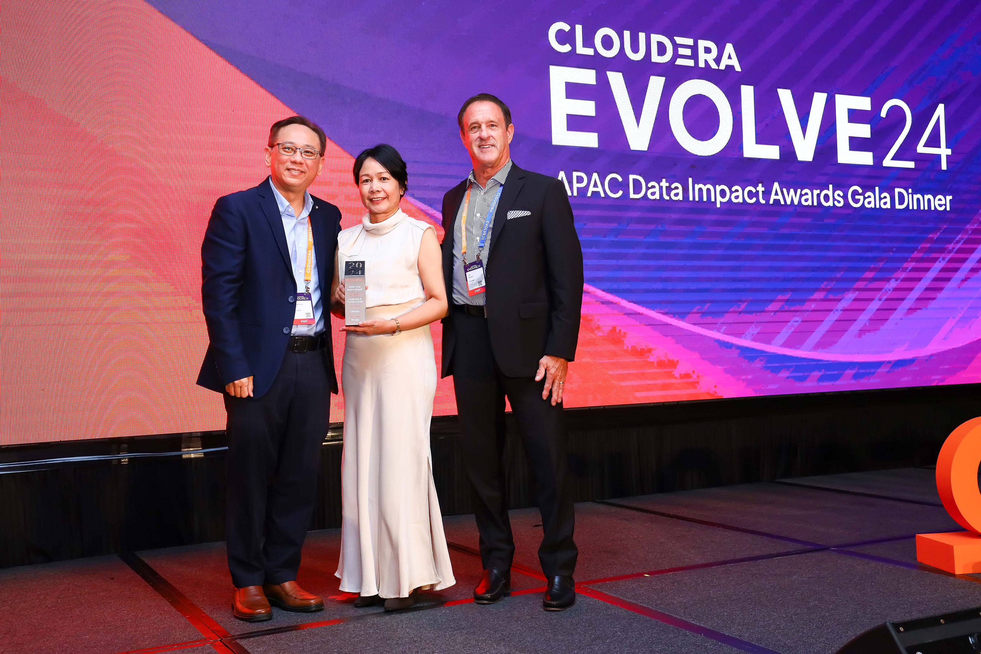 Three winners of the Data Impact award winners at Evolve Singapore 