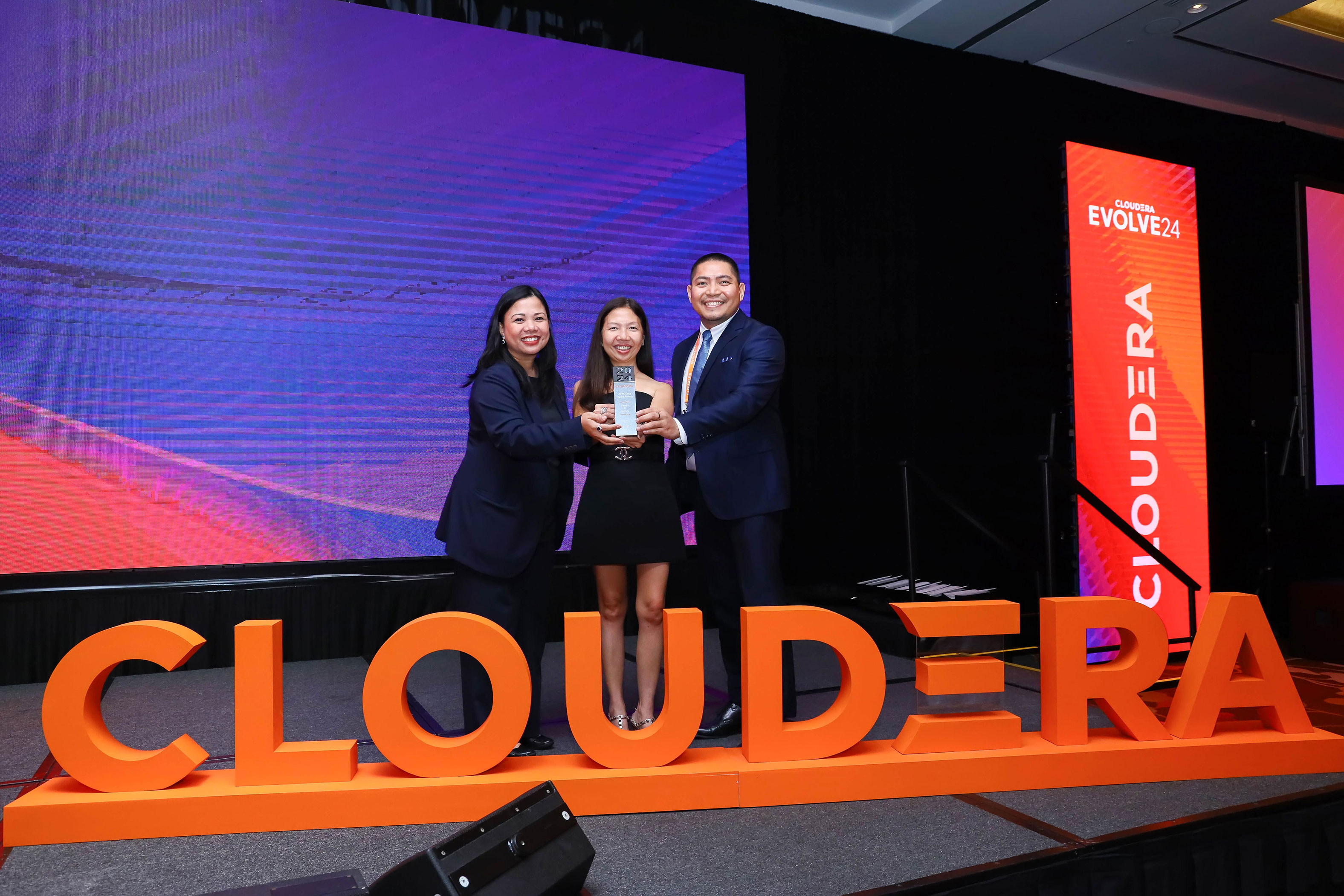 Three winners of the Data Impact award winners at Evolve