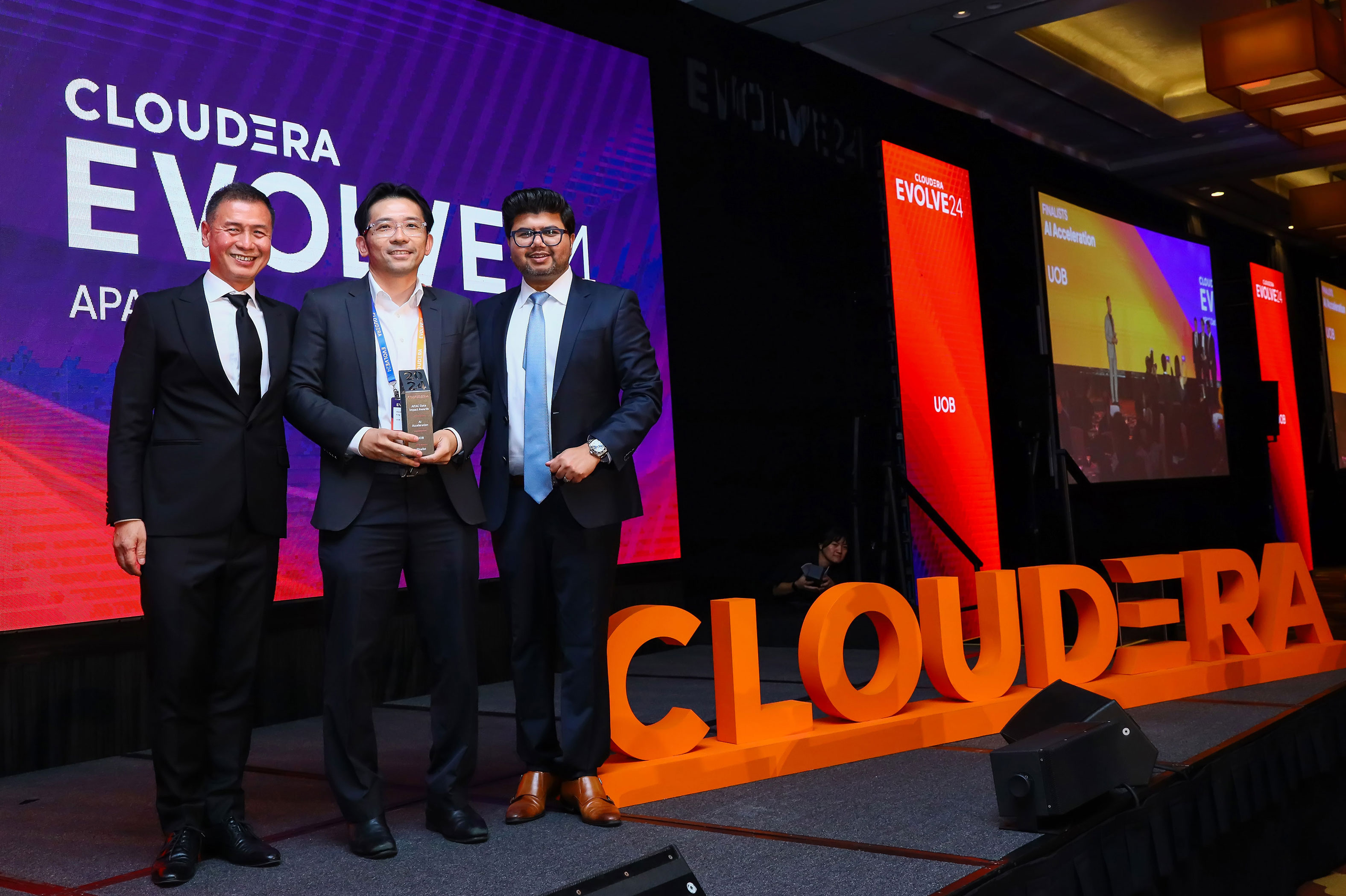 Three winners of the Data Impact award winners at Evolve