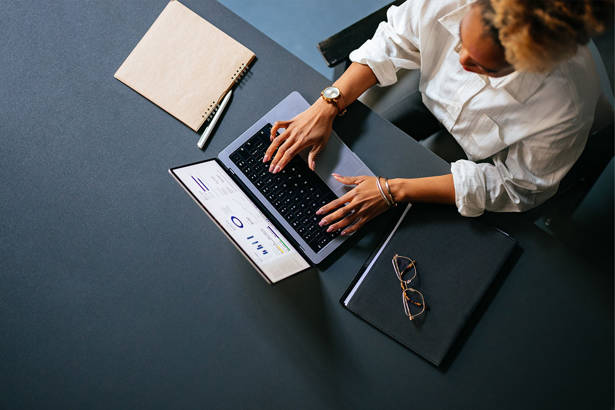 Overhead shot of woman working on a laptop