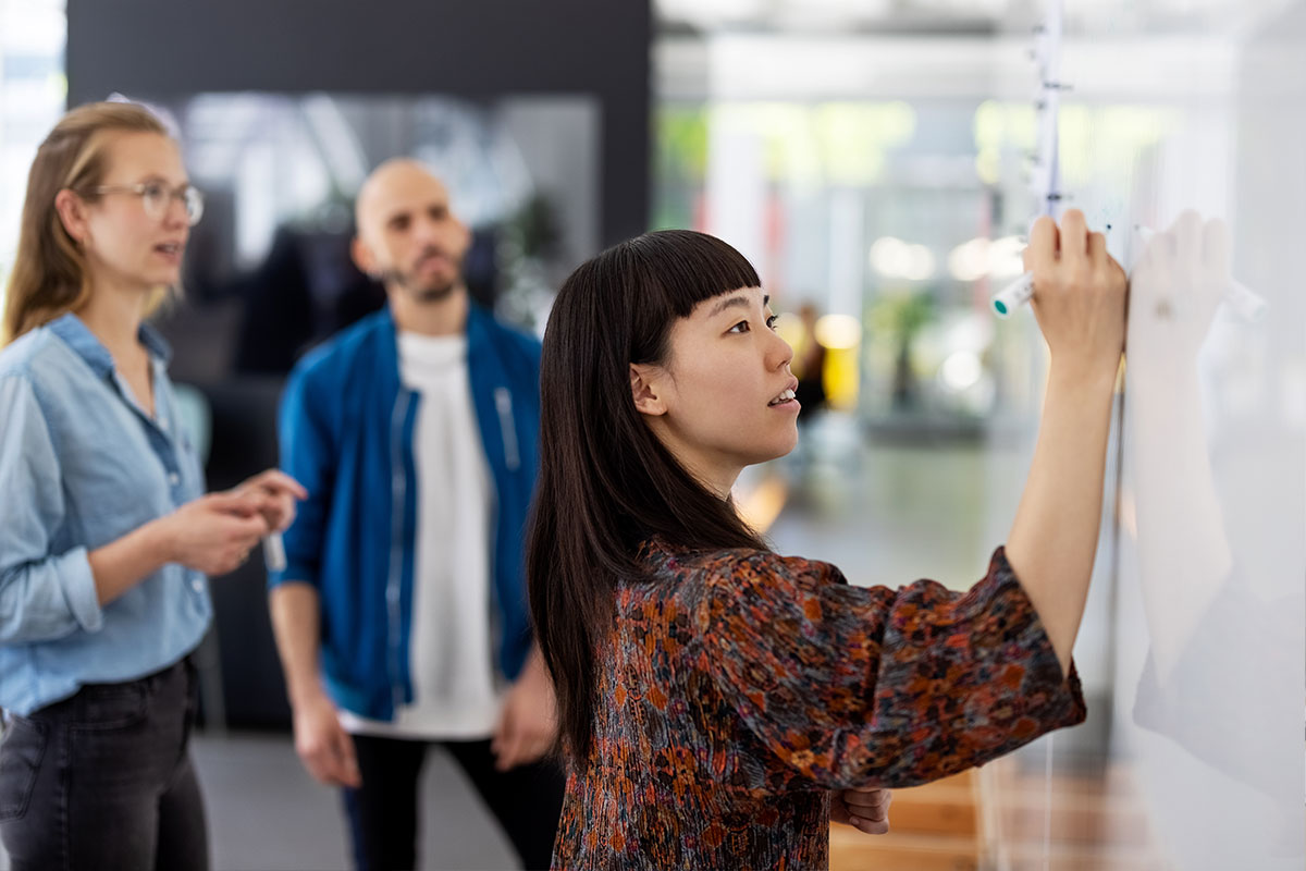 Group of employees training in a workshop setting. 