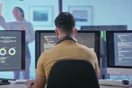 Thumbnail of two people working together at a computer