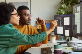 Thumbnail of two people working together at a computer