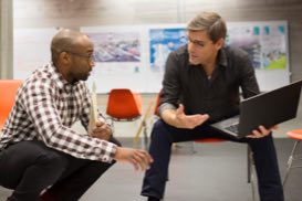 Thumbnail of two people working together at a computer