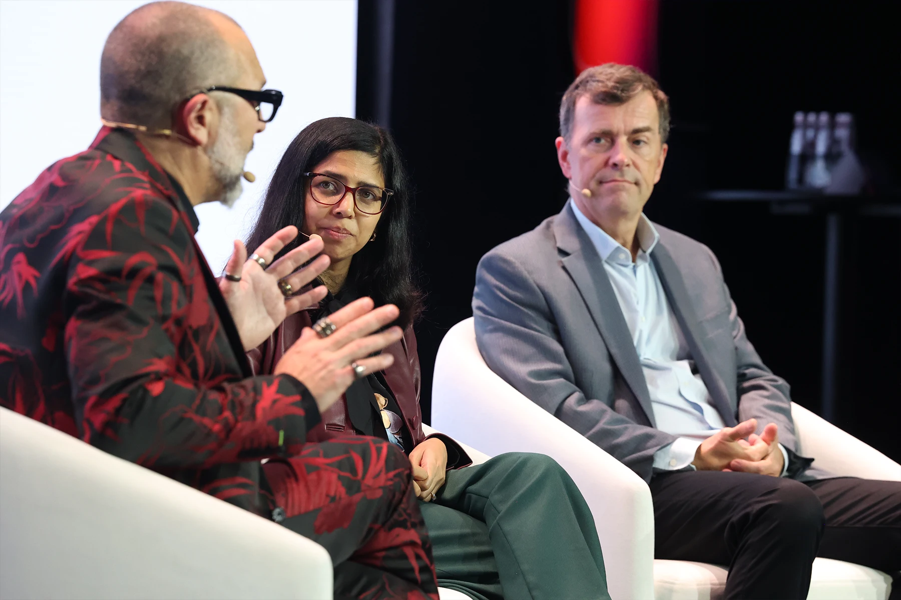 Groups of people talking at Evolve conference 