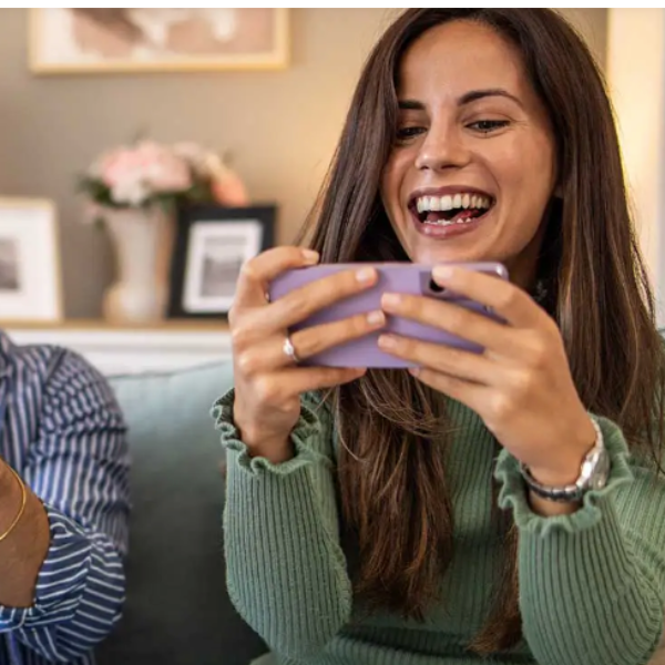 Woman smilimg looking at her phone