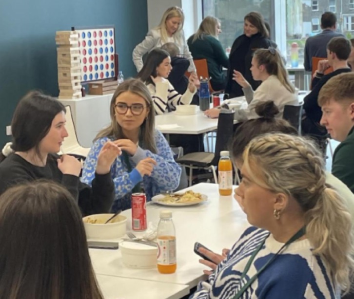 Employees eating lunch together