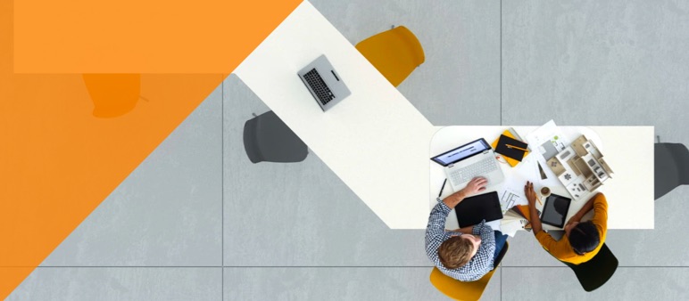 Image of people sitting at a desk working