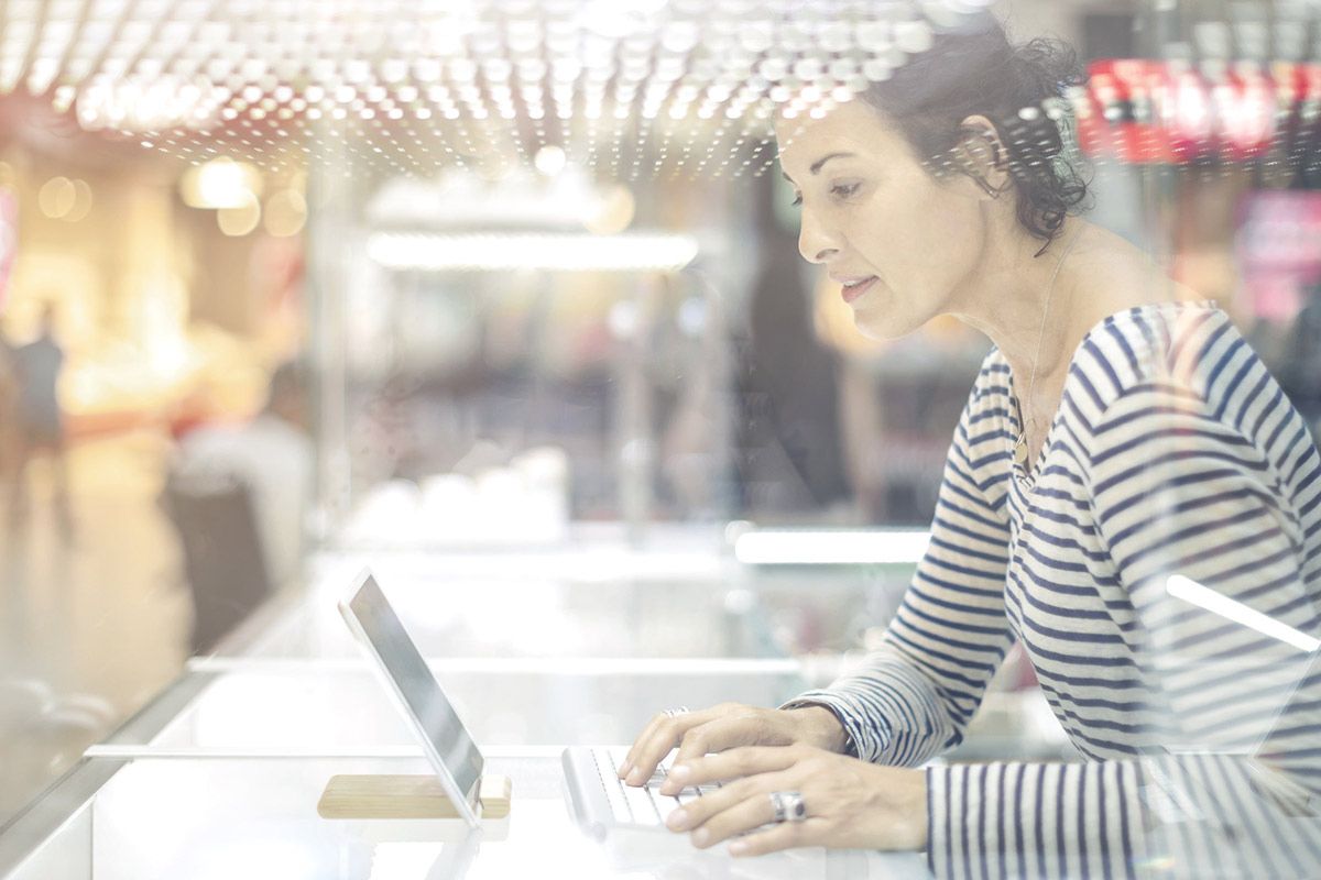 Woman sitting with laptop