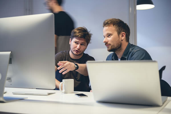 developers in front of a computer